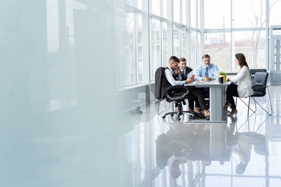 Businesspeople discussing together in conference room during meeting at office.