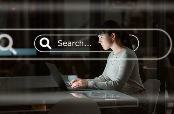 Woman typing to search for content on internet